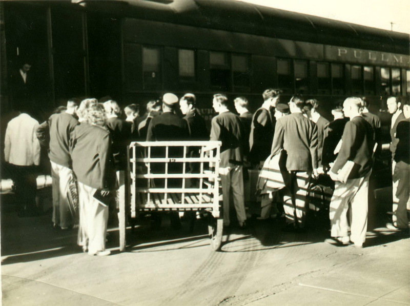 Band boarding train for Cal trip, November 1948
