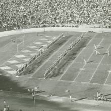 Company front as drum majors lead Band, 1950's