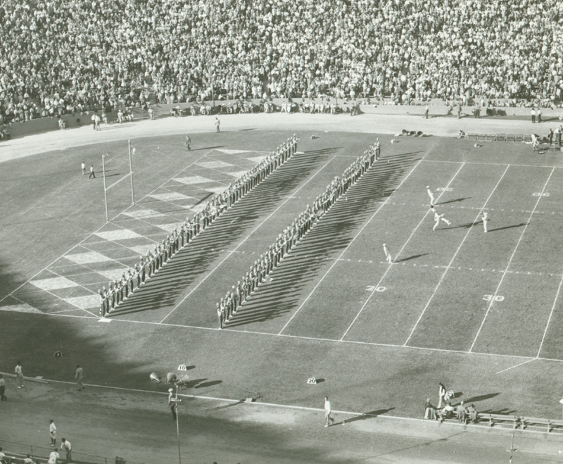 Company front as drum majors lead Band, 1950's