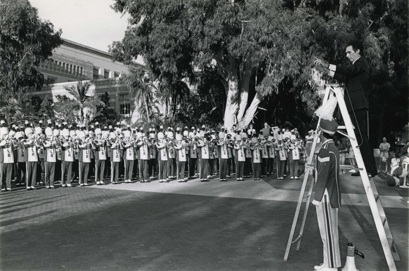 Bill Conti at the dedication of the Bruin Statue, conducting the Band in the premiere performance of "The Mighty Bruins," Bruin Plaza, 1984