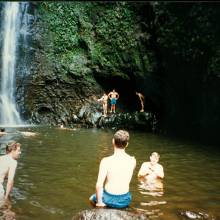 Band members at Sacred Falls waterfall