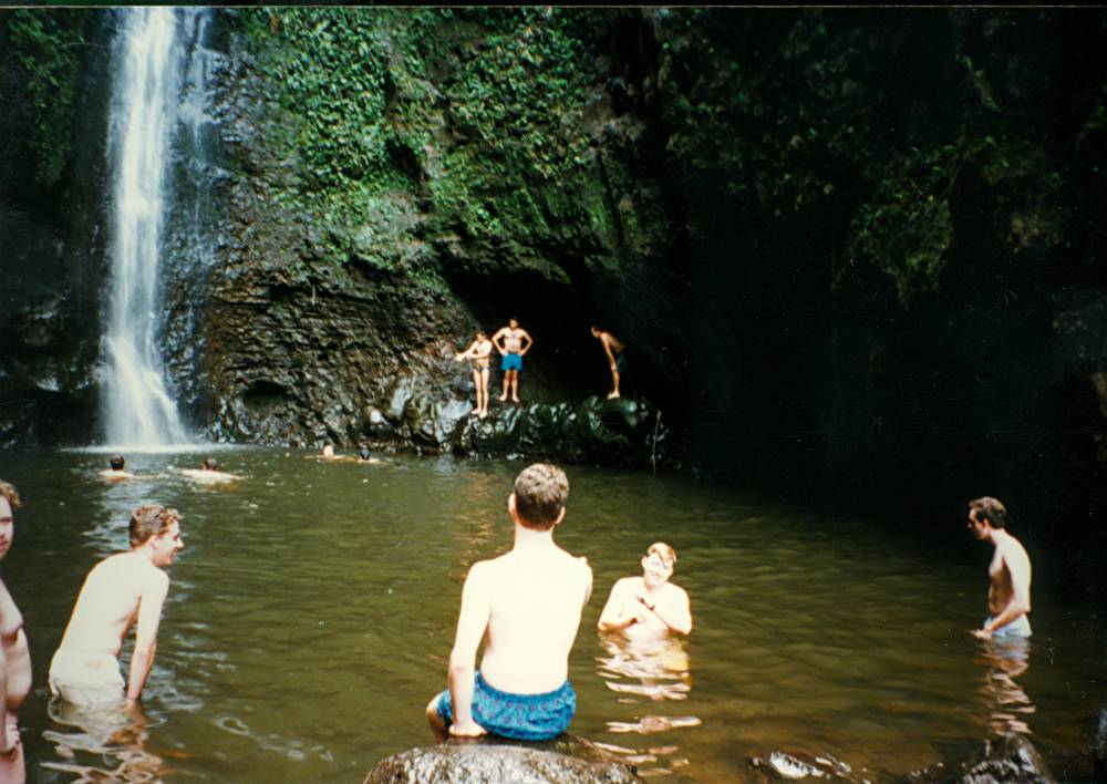 Band members at Sacred Falls waterfall