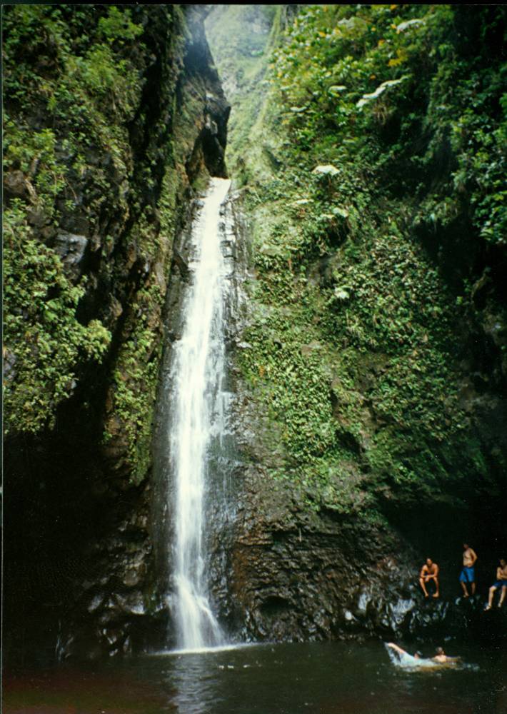 Band members at the Sacred Falls waterfall