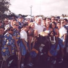 Chancellor Al Carnesale with Band members and the Spirit Squad before the infamous Miami game, December 5, 1998