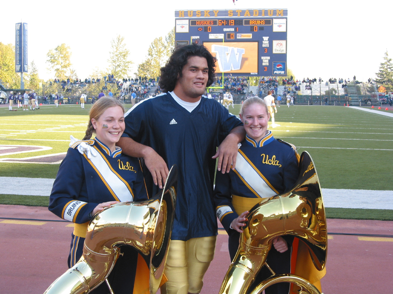 Tubas with UCLA football player in Husky Stadium, Washington game, November 2, 2002