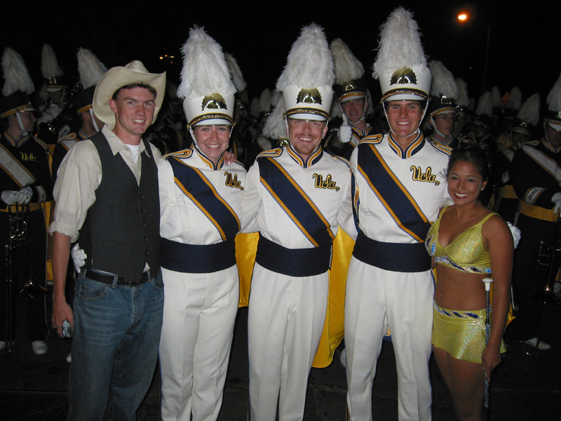 TA Carl Moren with Drum Majors Laura Montoya, Jay Dillon and Mike Froeberg, and Golden Girl Veena Goel. Carl rode on his fraternity's float that had a western theme.TA Carl Moren with Drum Majors Laura Montoya, Jay Dillon and Mike Froeberg, and Golden Girl Veena Goel. Carl rode on his fraternity's float that had a western theme. Homecoming 2002.