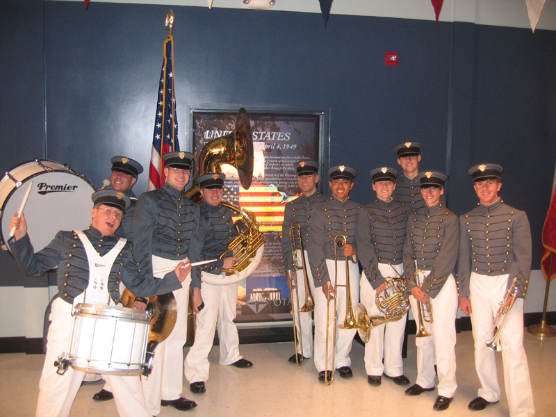 On the set of E-Ring, 2005. Ten UCLA Band members portrayed the West Point Academy Band in a scene with the show's stars, Dennis Hopper and Benjamin Bratt. Here is the band between takes on the set, which is a exact replica of the Pentagon.