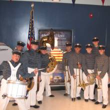 On the set of E-Ring, 2005. Ten UCLA Band members portrayed the West Point Academy Band in a scene with the show's stars, Dennis Hopper and Benjamin Bratt. Here is the band between takes on the set, which is a exact replica of the Pentagon.