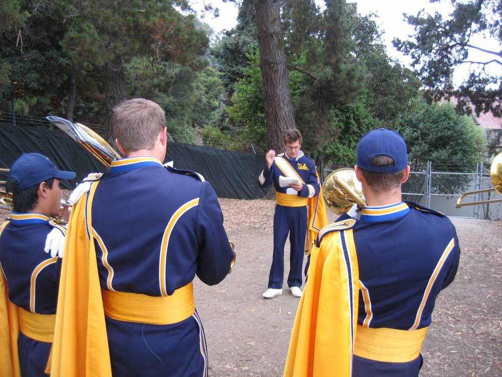 Clay McCarter conducts the Trombone section warmup above the Greek Theatre