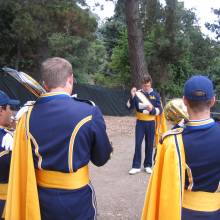 Clay McCarter conducts the Trombone section warmup above the Greek Theatre