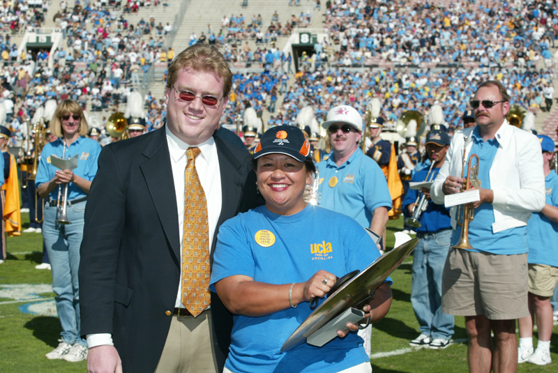 TA Robert Milford presenting Vangie Tangog with her award for traveling the furthest distance (Honolulu, Hawaii) to participate in the Band Alumni Reunion