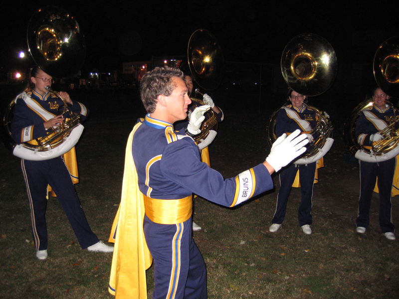 Sousaphone Section Leader Chris Bald leading the warmup before the Chino show