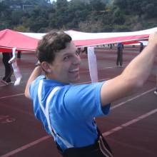 Matt Silverman holding flag at rehearsal