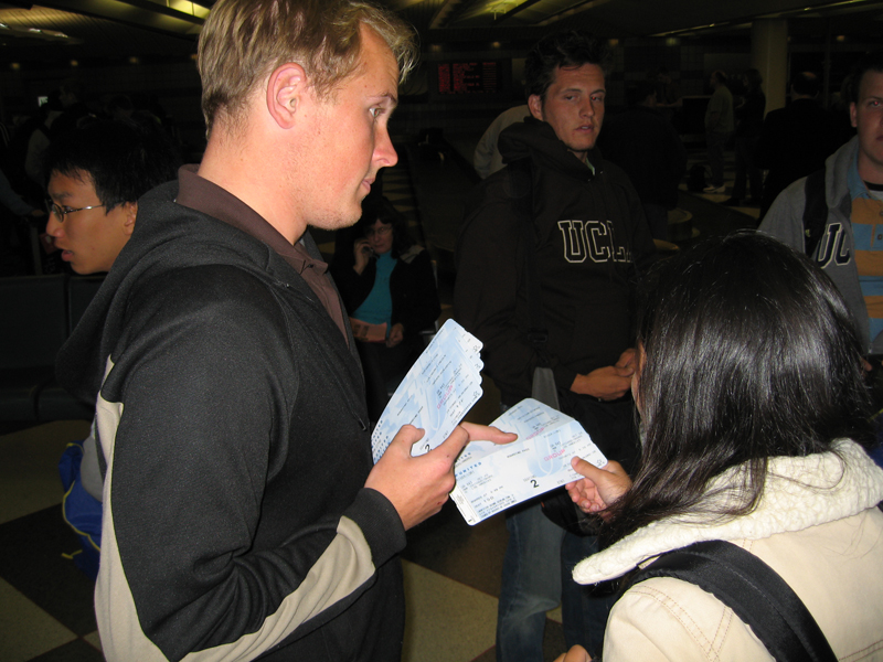 Drum Major Sean Garnreiter hands out airline tickets, Notre Dame trip 2006