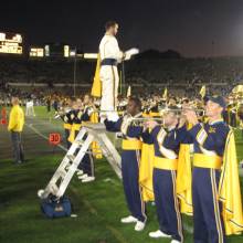 Drum Major Dan Thomson with trumpets, USC game, December 2, 2006