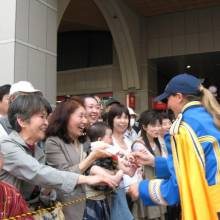 Greeting fans at the Festival Parade