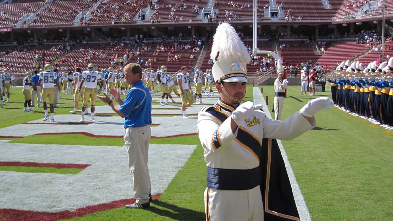 Coach Rick Neuheisel and Drum Major Keith Kupper, Band performing in end zone at Stanford, October 3, 2009