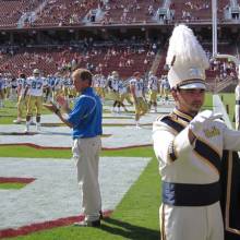Coach Rick Neuheisel and Drum Major Keith Kupper, Band performing in end zone at Stanford, October 3, 2009