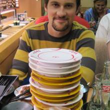 Counting the dishes taken at the the conveyor belt sushi restaurant