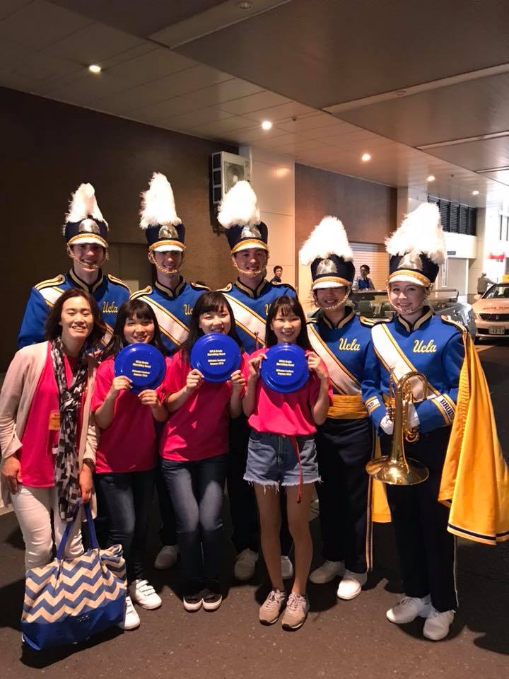 Photo with some fans showing off their Band Frisbees